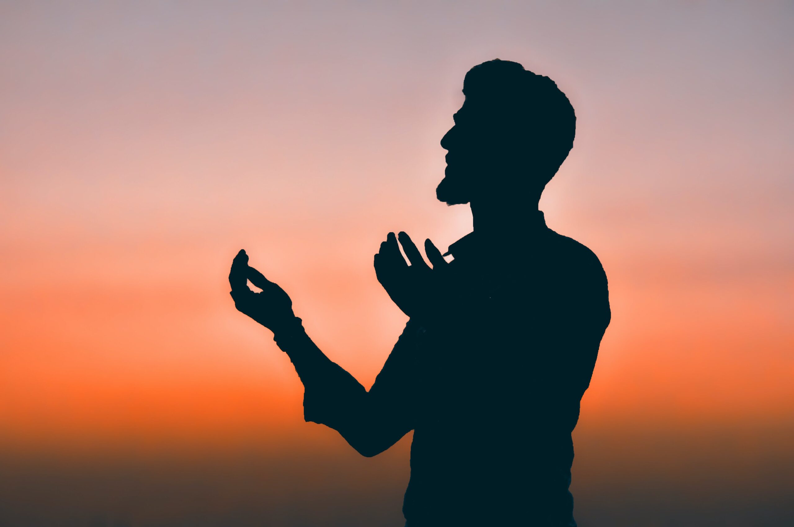 man praying to Allah